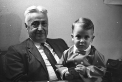 Paul M. Angell with grandchild Jim at Charles's graduation, circa 1961.
