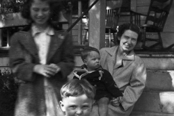 Pat, Charles, Gwen, Paul Jr., in front of home of Grandma Cora and Grandpa Merton Angell, Grand Rapids, Michigan circa 1944