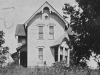 Front view of the Angell Homestead house, (?), Iola and Trix are so small you can scarcely see them,circa 1906.