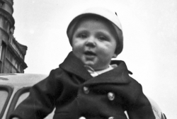 Paul Jr. sitting on back of the blue Nash. 2626 S. Michigan Ave., Chicago 1940